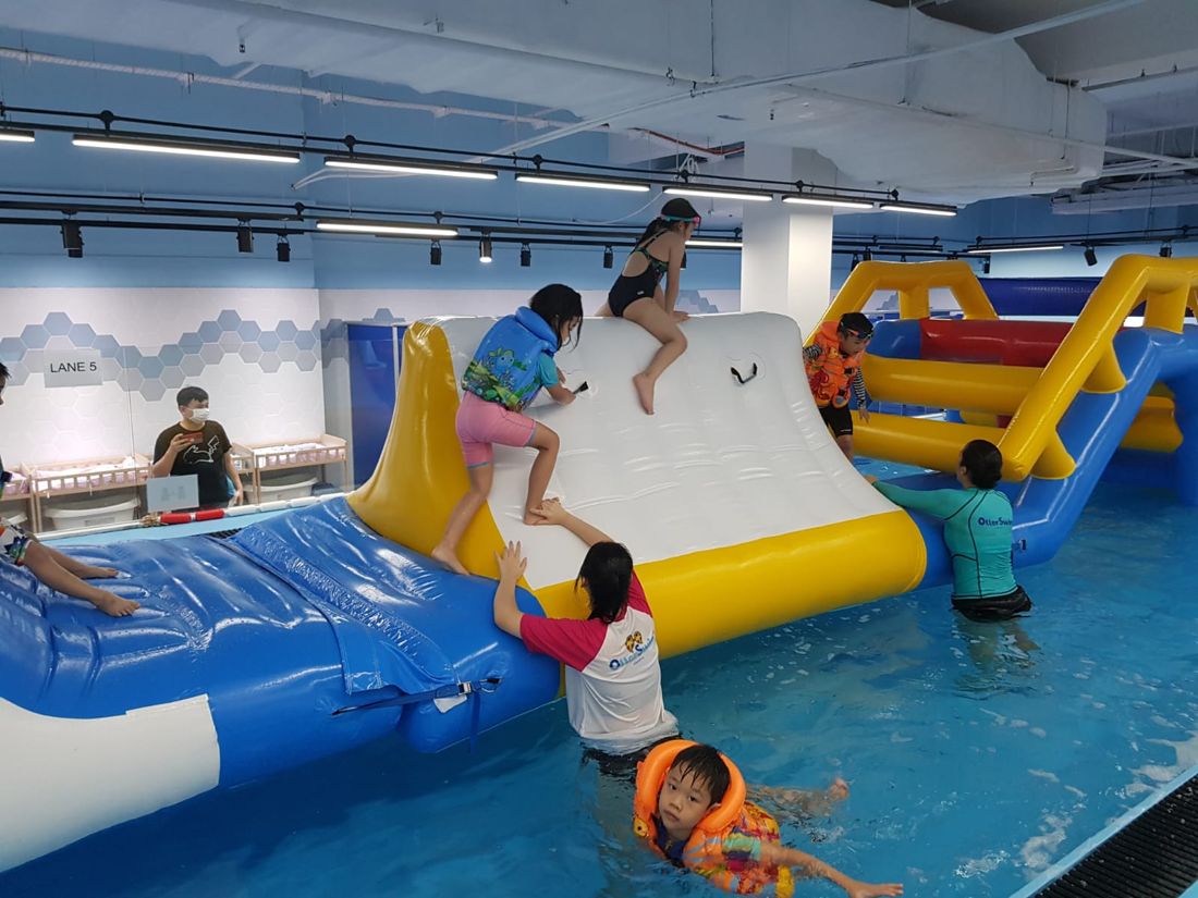Children on the floating obstacle course