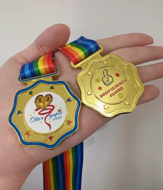 OtterLympic and Proficiency Award medals